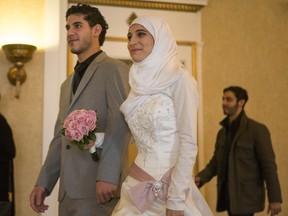Syrian refugees Athar Farroukh and Mohamad Al-Noury had a wedding reception with help from the community.