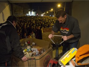 Saskatoon Food Bank volunteers pack donated food prior to the CP Holiday Train making a stop at the 7th Avenue Railway overpass on Sunday, December 6th, 2015. (Liam Richards/Saskatoon StarPhoenix)