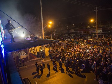The Devin Cuddy and Kelly Prescott band performs for a large crowd, estimated over 10,000, during the CP Holiday Train stop at the Seventh Avenue Railway overpass in Saskatoon, December 6, 2015.