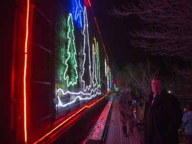 Saskatoon Mayor Don Atchison watches as the CP Holiday Train arrives to make a stop at the Seventh Avenue Railway overpass in Saskatoon, December 6, 2015.