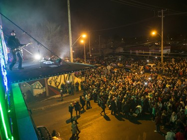 The Devin Cuddy and Kelly Prescott band performs for a large crowd, estimated over 10,000, during the CP Holiday Train stop at the Seventh Avenue Railway overpass in Saskatoon, December 6, 2015.