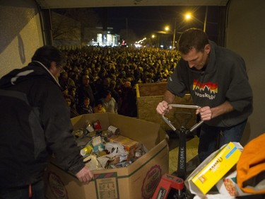 Saskatoon Food Bank volunteers pack donated food prior to the CP Holiday Train making a stop at the Seventh Avenue Railway overpass in Saskatoon, December 6, 2015.