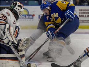 Cameron Hebig of the Saskatoon Blades can't get a stick on a deflection as he is covered by Kamloops Blazers Dallas Valentine Friday at SaskTel Centre.
