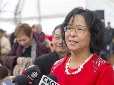 Dawn Jhou, project committee member, speaks to the media during the unveiling of the new Chinese Ting artwork event in Victoria Park, December 12, 2015.