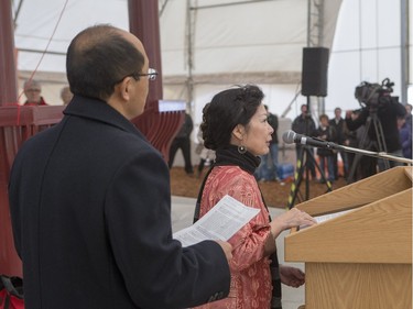 Masters of ceremonies speak during the unveiling of the new Chinese Ting artwork event in Victoria Park, December 12, 2015.