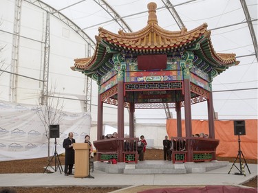 Masters of ceremonies speak during the unveiling of the new Chinese Ting artwork event in Victoria Park, December 12, 2015.