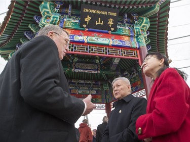Saskatoon mayor Don Atchison speaks with General Wang Xingping, from the Consulate General of the People's Republic of China in Calgary, and his wife Mrs. Wang during the unveiling of the new Chinese Ting artwork event in Victoria Park, December 12, 2015.