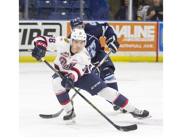 Regina Pats defenceman Brady Pouteau passes the puck against the Saskatoon Blades during second period WHL action, December 13, 2015.