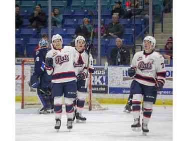 Regina Pats forward Adam Brooks (L) celebrates a goal with teammates against the Saskatoon Blades during first period WHL action, December 13, 2015.