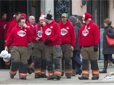 The Carolling Firefighter were making there way through downtown Saskatoon, as they have for many years, collecting spare change for charity, December 18, 2015.