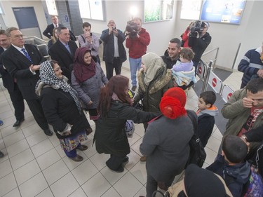 Syrian refugees arrive at the Saskatoon airport on December 19, 2015.