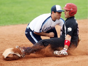 Canada played Argentina in the World men's softball tournament on June 30, 2015 in Saskatoon. Canada's Jeff Ellsworth is out at second base.
