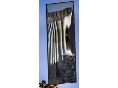 There is art in the placement of huge sheets of glass in the breeze to the new art gallery under construction, March 17, 2015.