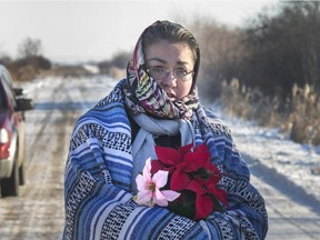 SASKATOON, SASK.; NOVEMBER  30, 2015 - 1201 news karinawolfe2  Walking With Our Sisters member Darlene Okemaysim-Sicotte arrives west of Saskatoon on a grid road to the site where Karina Wolfe's body was found wanting to lay flowers, November 30, 2015 Karina Wolfe was last seen 5 years ago before Jerry Constant recently came forward to Saskatoon police giving a description of where her body lies. Jerry has now been charged with Karina's death in court. (GORD WALDNER/Saskatoon StarPhoenix)      1201 dead woman