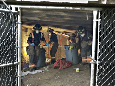 Saskatoon firefighters were called to clean up a homeless shelter under the Victoria Bridge westside where a group of homeless people took up residence, September 16, 2015.