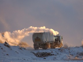 A garbage truck leaves the city landfill.