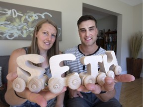 Andrea and Kyle Halstead are having a hard time getting their adopted son from The Congo. Photo with a child's train in their home, Wednesday, August 27, 2014.