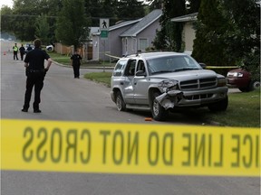 SASKATOON,SK-- AUGUST 27/2014--Police mark and investigate a collision on 23rd STreet West between Avenue P and R,  which witnesses say left a pedestrian in serious condition, Wednesday, August 27, 2014. (GREG PENDER/STAR PHOENIX)