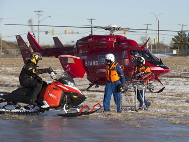 STARS Air Ambulance Saskatoon stages a mock rescue of an injured snowmobiler at the airport, December 8, 2015.