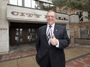 Saskatoon Mayor Don Atchison, posing in front of city hall, says much has been accomplished in his 12 years as mayor, but he's got a lot more to do.