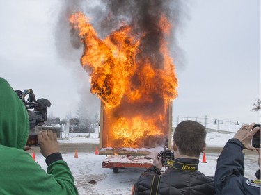 Firefighters did a live burn demonstration of a natural Christmas Tree set in a mock living room scene outside Fire Hall No. 6 on Taylor Street East, December 10, 2015 to highlight the need for seasonal safety.