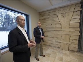 Colin Tennent, associate vice-president and university architect, Facilities Management Division (L) and Graeme Joseph, team leader of First Nations, Métis and Inuit student success at the U of S, speak as media were given a sneak-peek tour of the soon-to-open Gordon Oakes Redbear Student Centre at the University of Saskatchewan, Dec. 15, 2015.