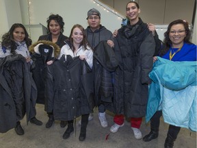 Lighthouse staff members Myrna Durocher, left, Tricia Gardypie, Julia Mudrey, Lanny McDonald, Rylan Smallchild and Dawn Mentuck fundraised to be able to hand out 37 winter coats to Saskatoon homeless people.