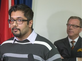 SASKATOON,SK--DECEMBER 21, 2015--  Noman Hassan, spokesman for the Saskatoon Ahmadiyya Muslim Jama'at, speaks to reporters with Saskatchewan Premier Brad Wall in the background.