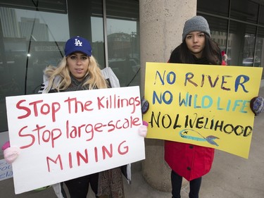 Organizers Renata Huyghebaert (L) and Priscila Silva of the U of S International Women's Movement protest at BHP Billiton's Saskatoon offices because of a dam breaking in Brazil, leading to environmental damage, December 22, 2015.