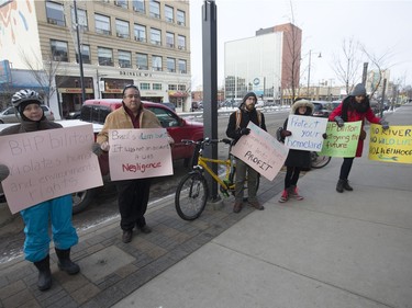 The U of S International Women's Movement protest at BHP Billiton's Saskatoon offices because of a dam breaking in Brazil, leading to environmental damage, December 22, 2015.