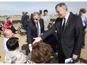 Premier Brad Wall and Education Minister Don Morgan at the sod turning for the joint use school in Rosewood.