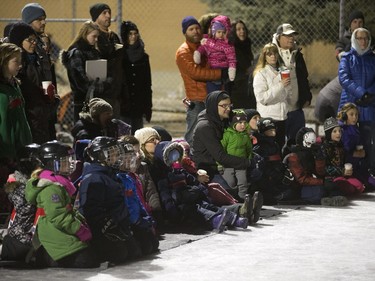 People watch a performance on ice at Victoria School of the Canadian classic The Hockey Sweater as part of the Winterlude festival, December 3, 2015. The event runs to December 5.