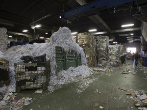 Saskatoon city council is spending more than $325,000 to study garbage disposal in the city and come up with a plan to divert more waste from the landfill. This 2014 photo shows the interior of Cosmopolitan Industries, which runs the city's curb-side recycling collection program for apartments and townhouses.