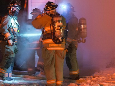 Firefighters at the scene of a duplex fire on Imperial Street, November 30, 2015.