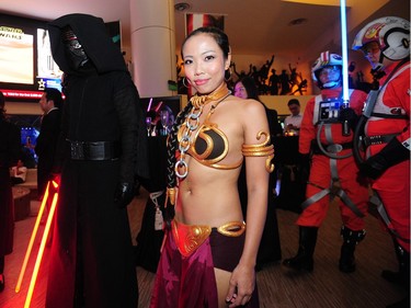 Promotional staff dressed as Star Wars characters attend the film premiere of 'Star Wars: The Force Awakens' in Singapore on December 16, 2015.