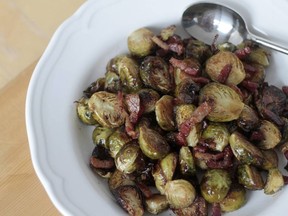 Calgary, Alberta - NOVEMBER 24, 2014 - Even those who dread Brussels sprouts can find something to like in these ones, which are roasted with bacon and topped with maple syrup and balsamic vinegar. (Gwendolyn Richards/Calgary Herald) For Food story by Gwendolyn Richards.