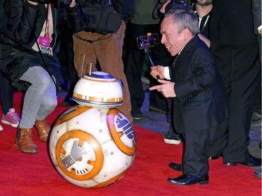 Warwick Davies and Star Wars droid BB-8 arrive for the European premiere of "Star Wars: The Force Awakens" at Leicester Square on December 16, 2015 in London, England.