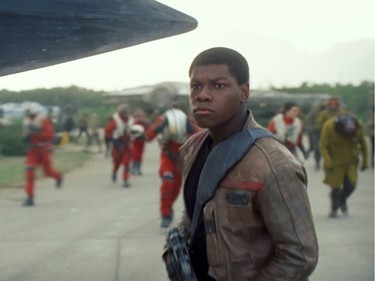 John Boyega stars as Finn in "Star Wars: The Force Awakens," directed by J.J. Abrams.