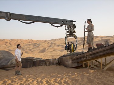 Director J.J. Abrams and actor Daisy Ridley on the set of "StarWars: The Force Awakens."