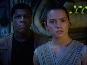 John Boyega as Finn  and Daisy Ridley as Rey in "Star Wars: The Force Awakens."