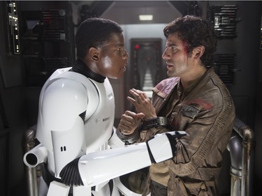 John Boyega as Finn (L) and Oscar Isaac as Poe Dameron in "Star Wars: The Force Awakens."