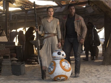 Daisy Ridley as Rey and John Boyega as Finn in "Star Wars: The Force Awakens."