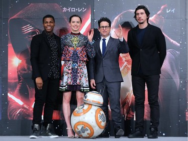 L-R: Actors John Boyega, Daisy Ridley, director J.J. Abrams and actor Adam Driver pose with BB-8 at the press conference for the "Star Wars: The Force Awakens" premiere at the Sheraton Grande Tokyo Bay Hotel in Urayasu, Japan, December 11, 2015.