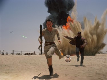 Daisy Ridley as Rey (L) and John Boyega as Finn in "Star Wars: The Force Awakens," directed by J.J. Abrams.