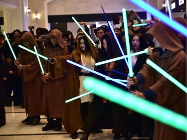 South Korean fans dressed as Star Wars characters attend a Jedi parade before a release of the movie Star Wars: The Force Awakens at Lotte Cinema in Seoul on December 16, 2015.