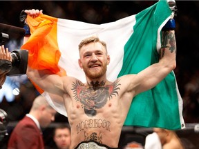 Conor McGregor celebrates after a first-round knockout victory over Jose Aldo in their featherweight title fight during UFC 194 on December 12, 2015 in Las Vegas, Nevada.