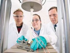 University of Saskatchewan student Dena Burnett (centre) in lab with supervisors Saija Kontulainen (left) and James Johnston (right). (photo by David Stobbe for the University of Saskatchewan)