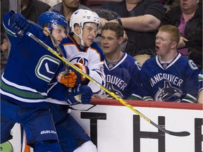 File Photo. Vancouver Canucks in action on April 11, 2015 against the Edmonton Oilers. Gerry Kahrmann/ PNG staff photo.