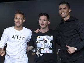 Brazil&#039;s Neymar, Argentina&#039;s Lionel Messi and Portugal&#039;s Cristiano Ronaldo, from left, the nominees for the FIFA Ballon d&#039;Or 2015 award, attend a press conference prior to the FIFA Ballon d&#039;Or awarding ceremony at the Kongresshaus in Zurich, Switzerland, Monday, Jan. 11, 2016. (Valeriano Di Domenico/Keystone via AP)