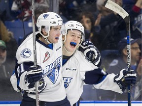 Saskatoon Blades forwards Josh Paterson, left, and Luke Gingras along with their teammates take on the Wheat Kings Friday night in Brandon.